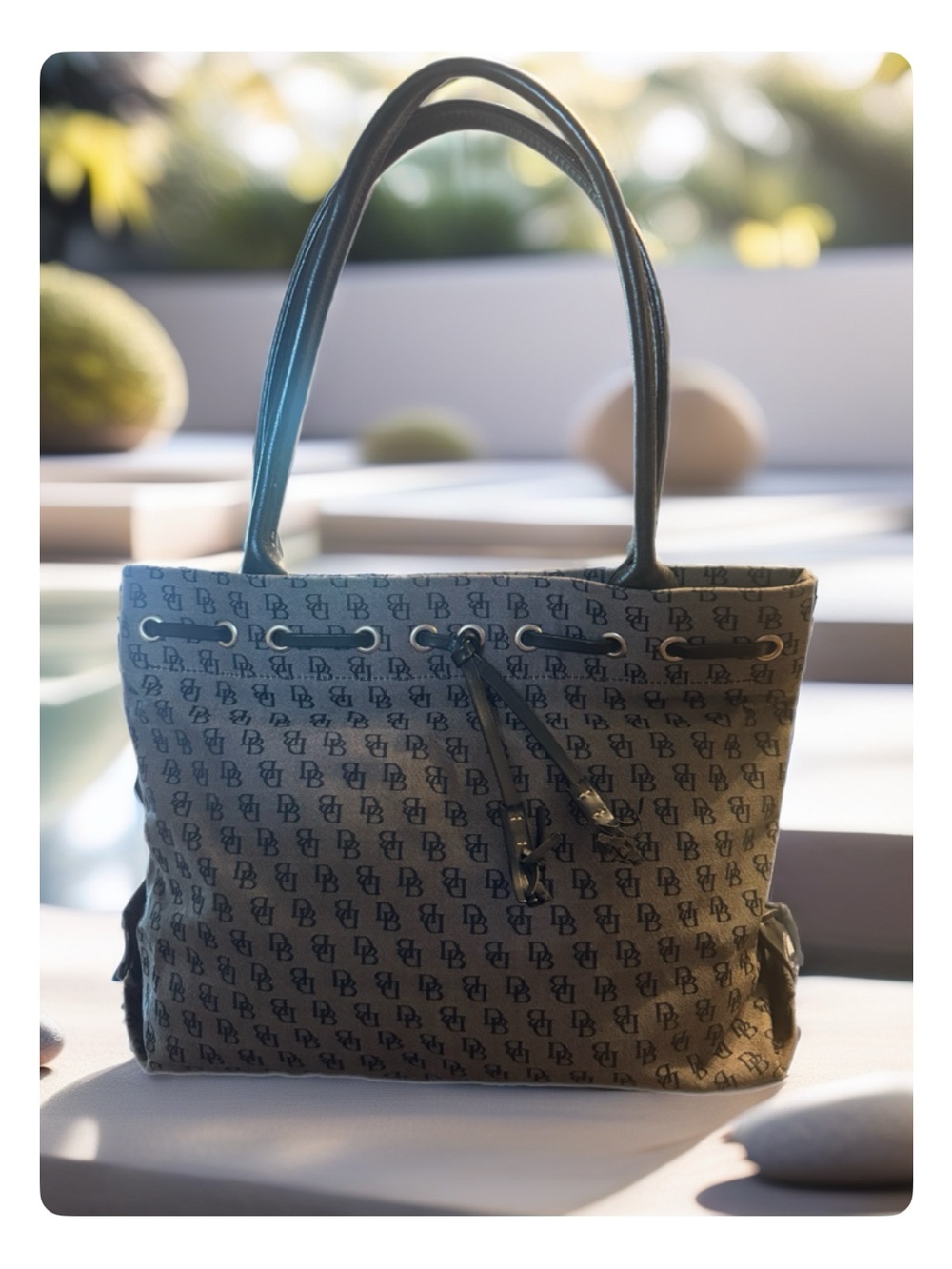 Dooney & Bourke Browns Monogram Drawstring Tote with Tassels